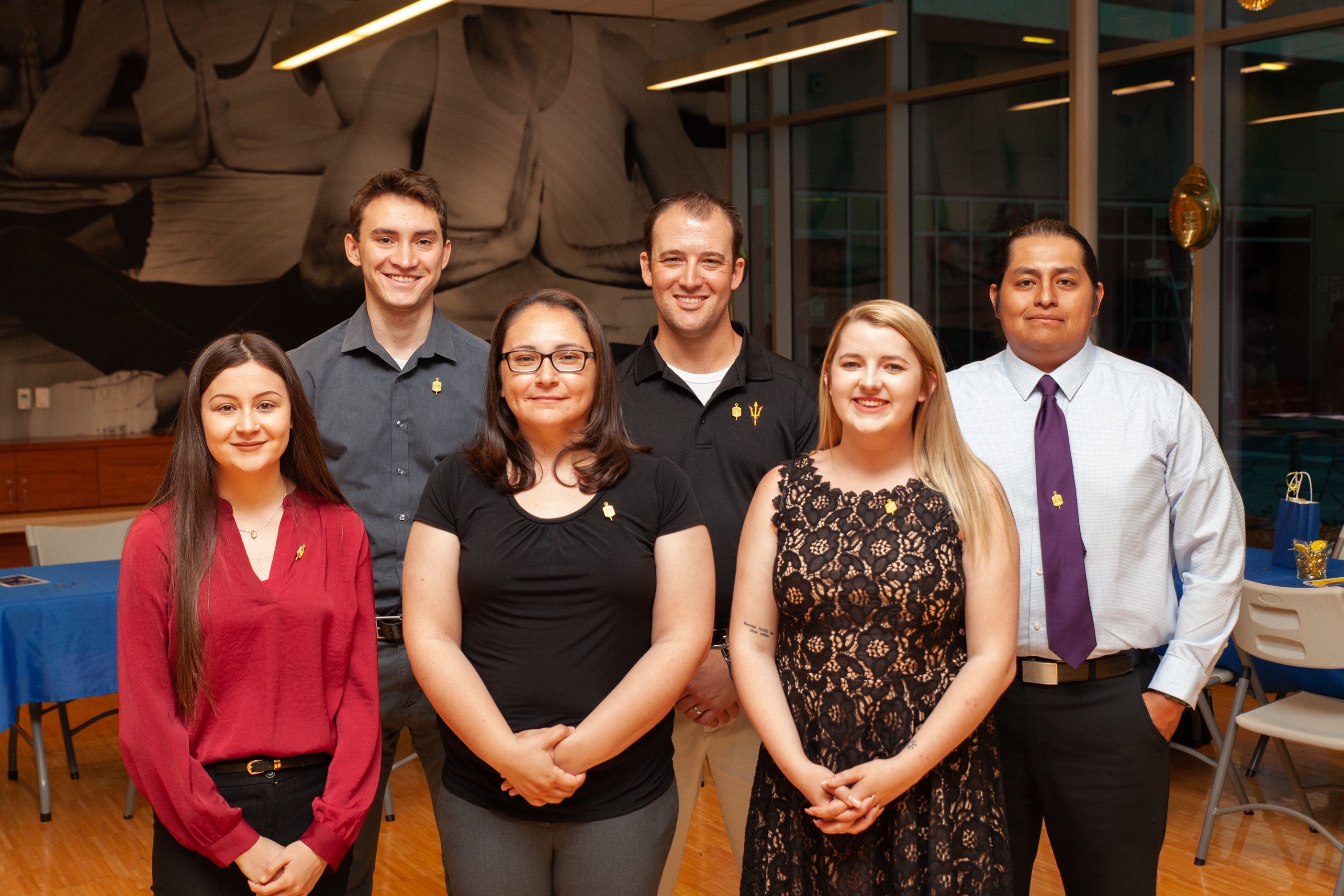 six students in formal attire smiling for picture  